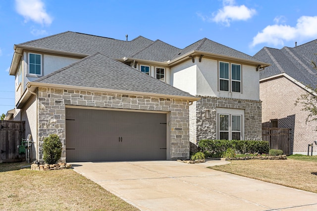 traditional home featuring a garage, stone siding, a shingled roof, and fence