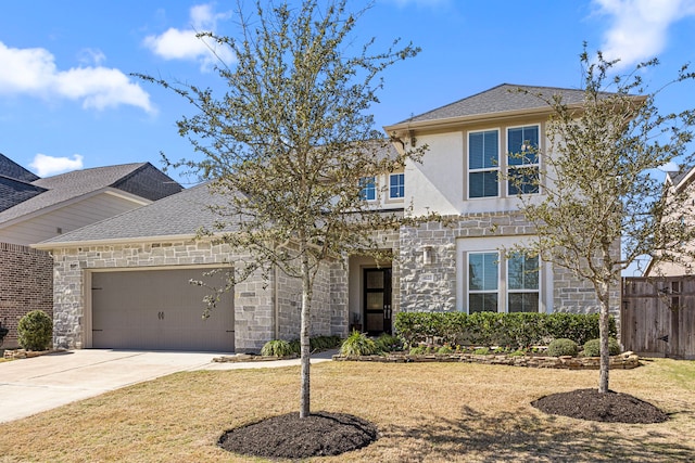 traditional-style house with an attached garage, stone siding, fence, and concrete driveway