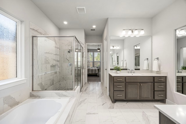 ensuite bathroom with visible vents, a stall shower, ensuite bath, and a bath