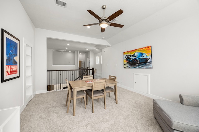 dining area featuring baseboards, visible vents, a ceiling fan, light colored carpet, and recessed lighting