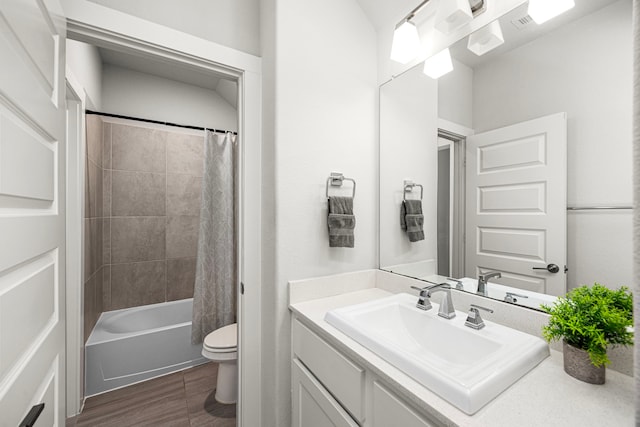 full bath featuring wood finished floors, vanity, toilet, and shower / bathtub combination with curtain