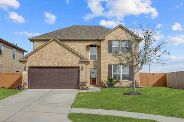 view of front of house featuring a garage, driveway, fence, a front lawn, and brick siding