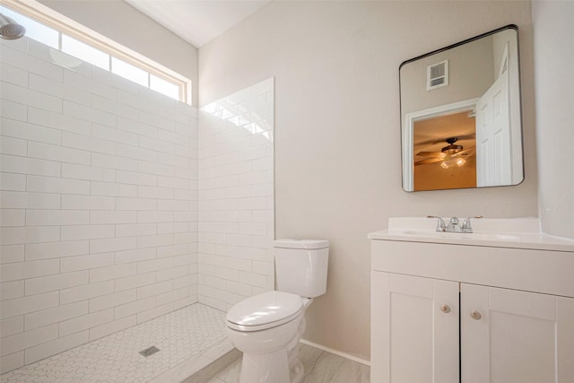 full bath featuring a stall shower, visible vents, vanity, and toilet