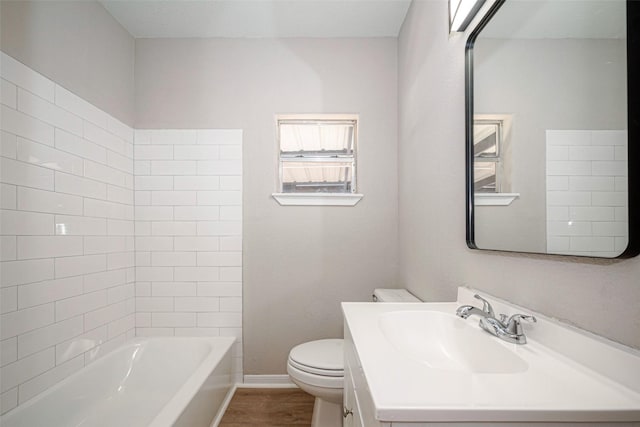 full bath featuring shower / bathtub combination, toilet, vanity, wood finished floors, and baseboards