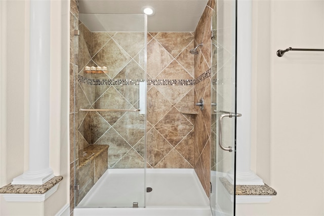 bathroom with a shower stall