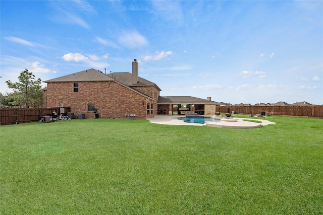 view of yard with a patio area, a fenced backyard, and a fenced in pool