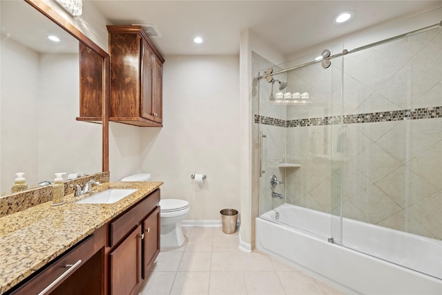 bathroom with enclosed tub / shower combo, tile patterned flooring, toilet, vanity, and baseboards