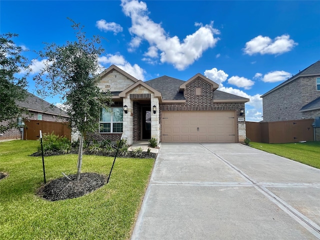 view of front facade with an attached garage, stone siding, a front lawn, and concrete driveway