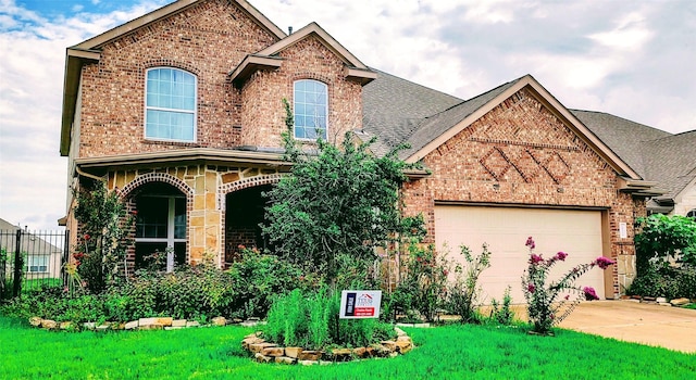 view of front of property with a garage, concrete driveway, brick siding, and roof with shingles