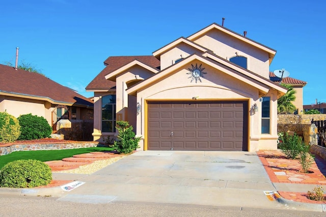 view of front of home with driveway and stucco siding