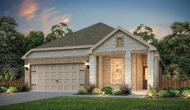 view of front facade with a garage, brick siding, fence, driveway, and stone siding