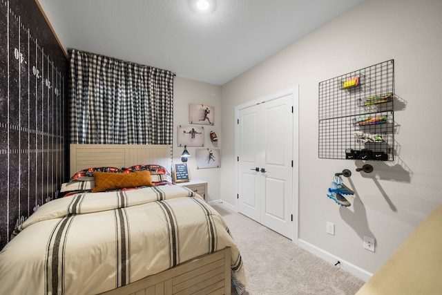 carpeted bedroom with baseboards