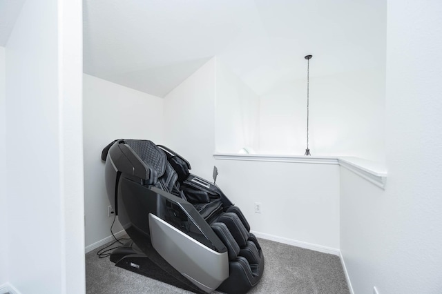 interior space featuring carpet floors, lofted ceiling, and baseboards