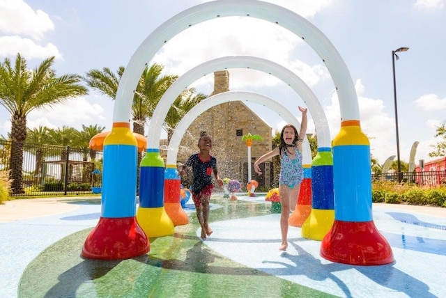 view of jungle gym with fence