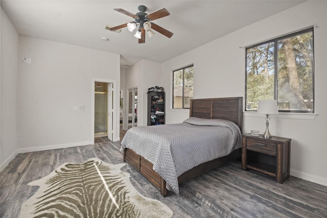 bedroom featuring dark wood-style floors, connected bathroom, ceiling fan, and baseboards