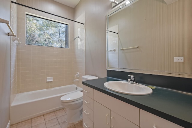 bathroom featuring tile patterned flooring, shower / bath combination, vanity, and toilet