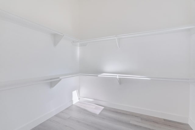 walk in closet featuring light wood-style floors