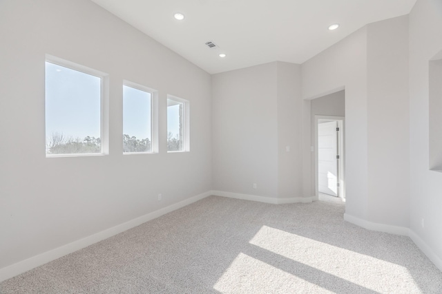 spare room with visible vents, baseboards, carpet flooring, and recessed lighting