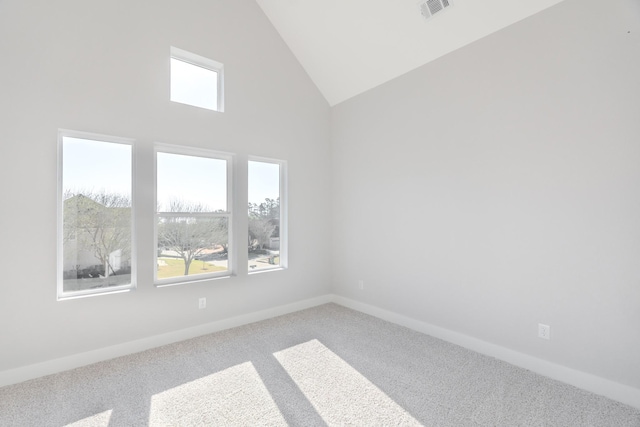 unfurnished room featuring high vaulted ceiling, visible vents, baseboards, and carpet flooring