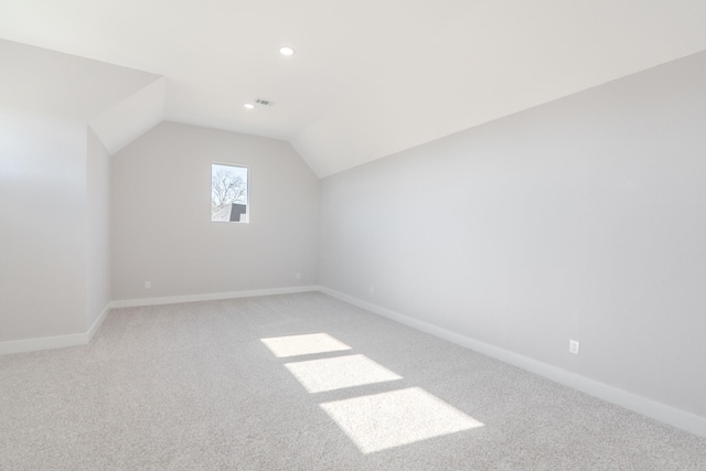 bonus room with carpet floors, baseboards, vaulted ceiling, and recessed lighting