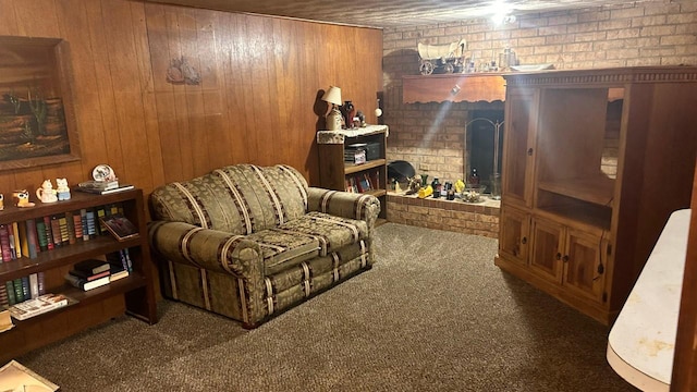 living area with dark carpet and wooden walls