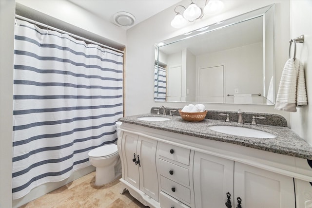 full bathroom with double vanity, toilet, a sink, and a shower with shower curtain