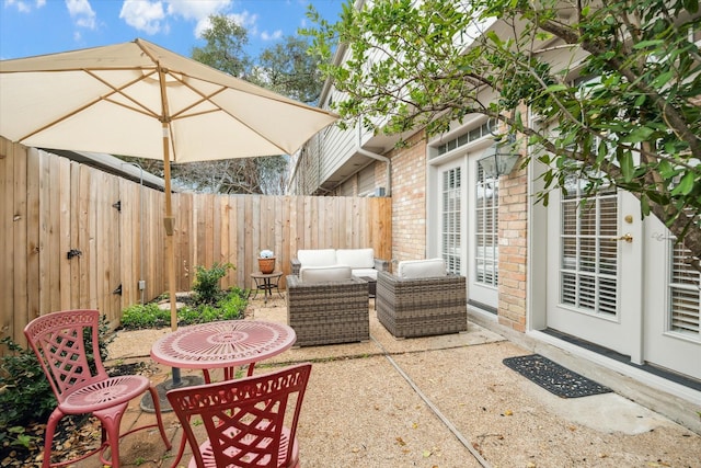 view of patio featuring a fenced backyard and an outdoor hangout area