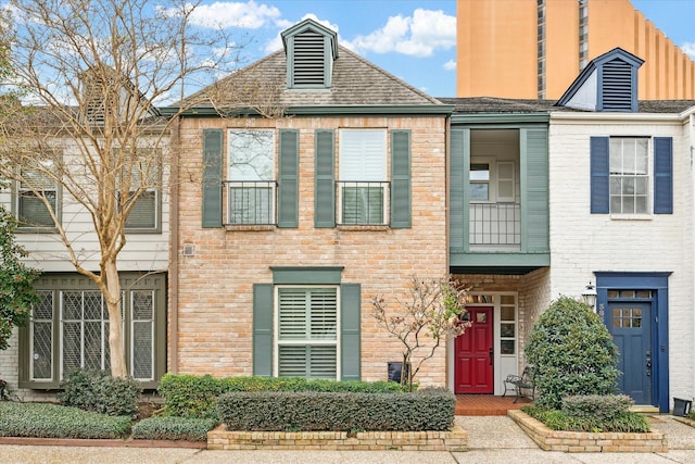 view of property with brick siding