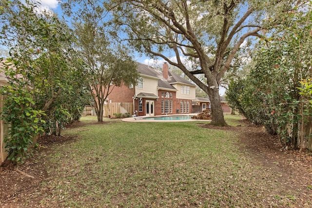 view of yard featuring a fenced in pool and a fenced backyard