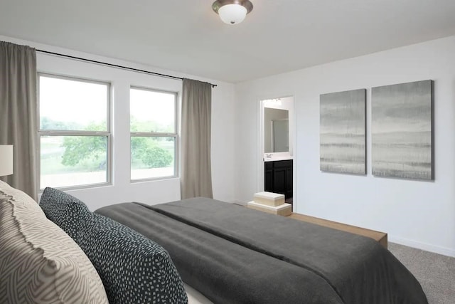 bedroom with baseboards and carpet flooring