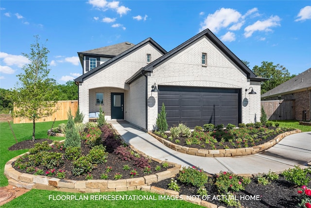 view of front of home featuring a garage, brick siding, and fence