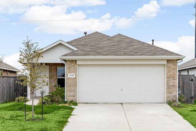 single story home featuring driveway, a front lawn, fence, and brick siding