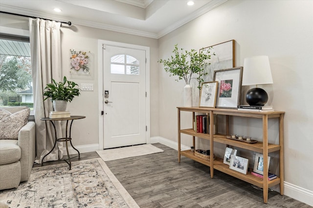 entryway with baseboards, dark wood finished floors, and crown molding