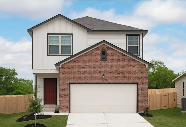 view of front facade with fence, board and batten siding, and brick siding