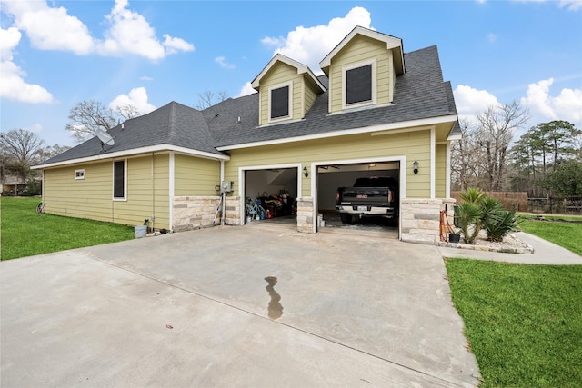 view of home's exterior featuring driveway, a shingled roof, a lawn, stone siding, and an attached garage