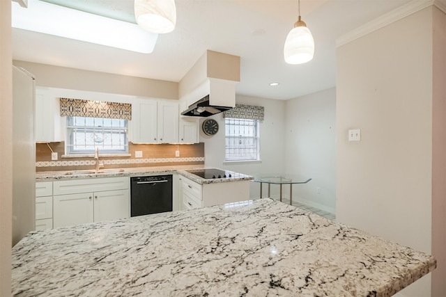 kitchen featuring tasteful backsplash, black appliances, white cabinetry, pendant lighting, and a sink