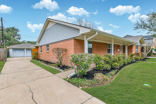 view of side of property with a garage, a yard, brick siding, and a porch