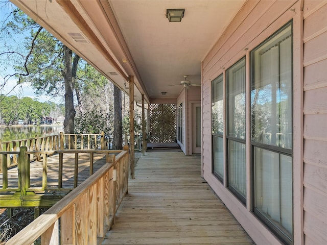 wooden deck with ceiling fan