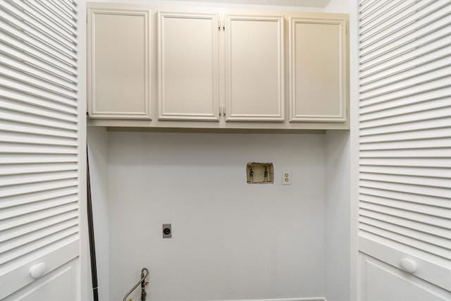 washroom featuring hookup for a washing machine, cabinet space, and electric dryer hookup