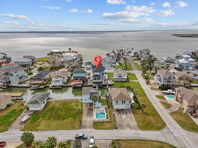 1250 Oahu Dr, Tiki Island, TX 77554 - birds eye view of property featuring a water view and a residential view