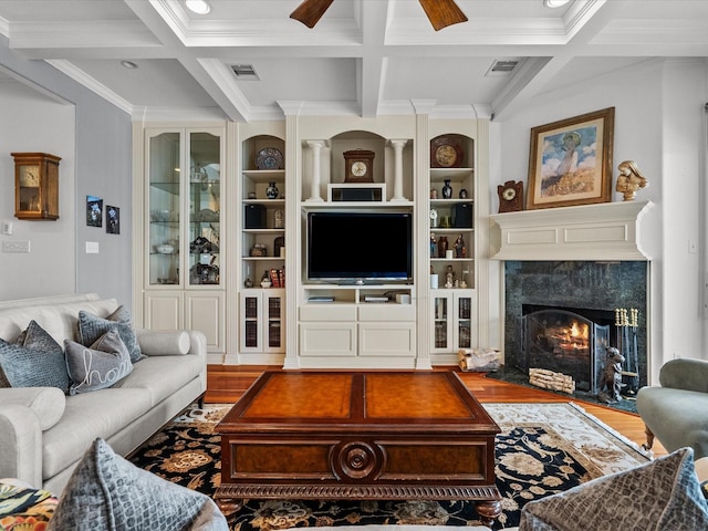 1250 Oahu Dr, Tiki Island, TX 77554 - living area featuring visible vents, crown molding, wood finished floors, beamed ceiling, and coffered ceiling