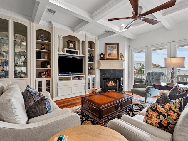 1250 Oahu Dr, Tiki Island, TX 77554 - living room with ceiling fan, beam ceiling, wood finished floors, visible vents, and coffered ceiling