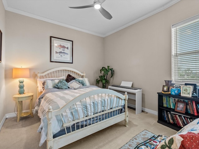 1250 Oahu Dr, Tiki Island, TX 77554 - carpeted bedroom featuring baseboards, crown molding, and ceiling fan