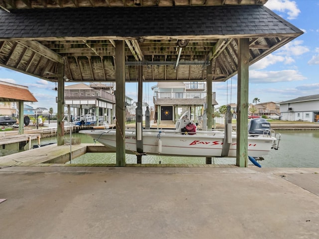 1250 Oahu Dr, Tiki Island, TX 77554 - view of home's community with a boat dock and a water view