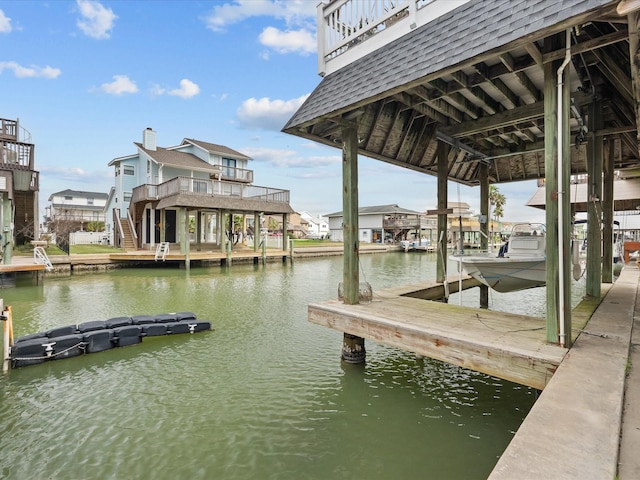 1250 Oahu Dr, Tiki Island, TX 77554 - dock area featuring a water view and boat lift