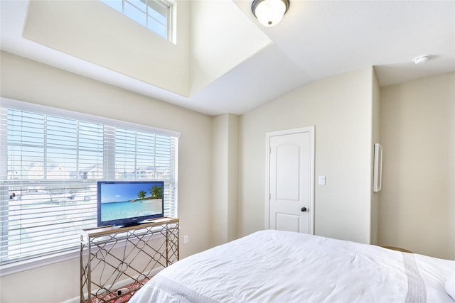 bedroom with lofted ceiling