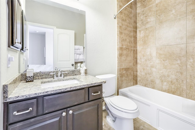 bathroom featuring toilet, vanity, bathing tub / shower combination, and tile patterned floors