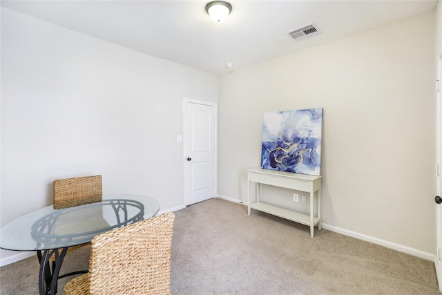 interior space featuring carpet flooring, visible vents, and baseboards