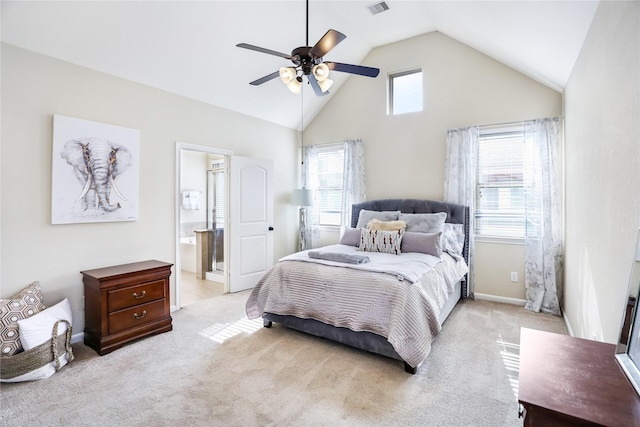 bedroom featuring high vaulted ceiling, light colored carpet, visible vents, a ceiling fan, and ensuite bath