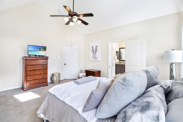 bedroom with baseboards, ensuite bath, ceiling fan, carpet floors, and high vaulted ceiling